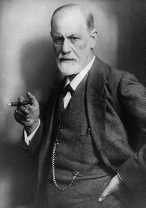 Sigmund Freud, founder of psychoanalysis, smok...